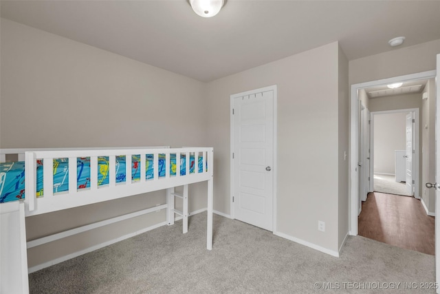 bedroom featuring baseboards and carpet flooring