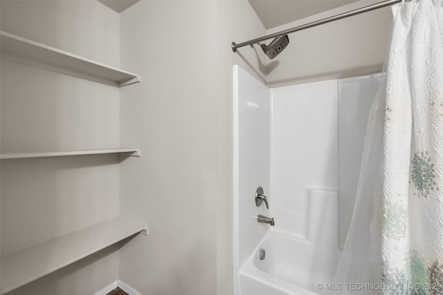 bathroom featuring shower / bath combo with shower curtain