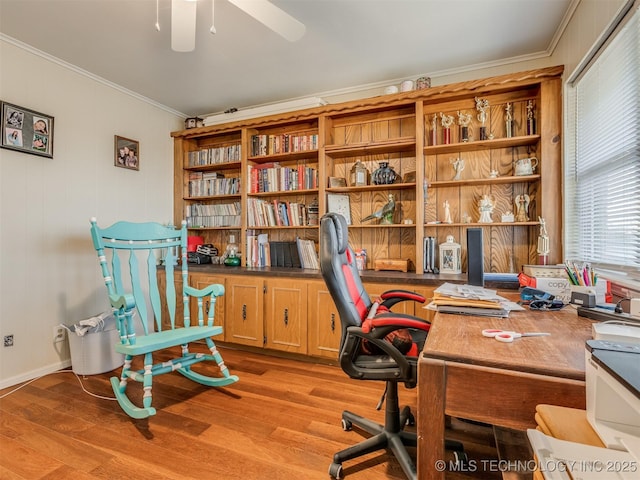 home office with a ceiling fan, light wood-style floors, and ornamental molding