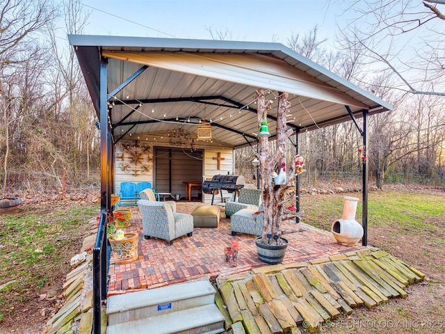 view of patio featuring outdoor lounge area and fence