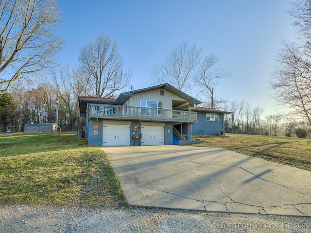 view of front of house featuring a garage, central AC unit, driveway, and a front lawn