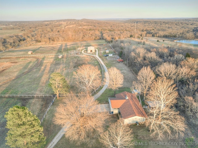 birds eye view of property with a rural view