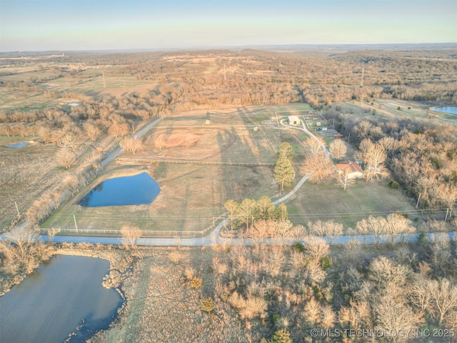 drone / aerial view featuring a rural view and a water view