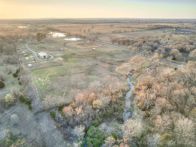 birds eye view of property featuring a rural view