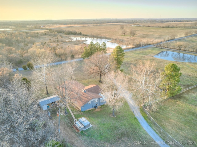 birds eye view of property with a water view and a rural view