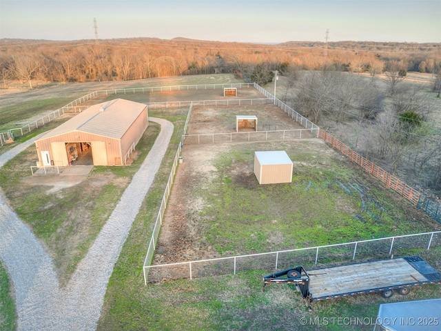 birds eye view of property featuring a rural view