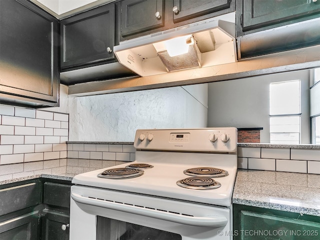 kitchen with white range with electric stovetop, decorative backsplash, dark cabinetry, and under cabinet range hood