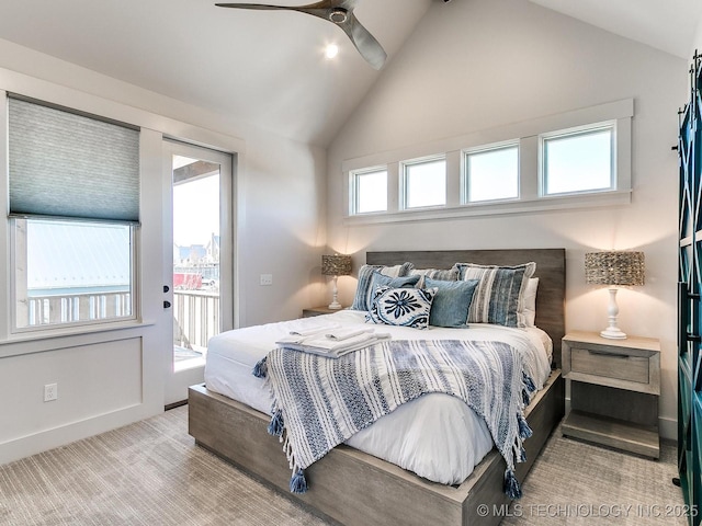 carpeted bedroom featuring access to exterior, baseboards, lofted ceiling, and a ceiling fan