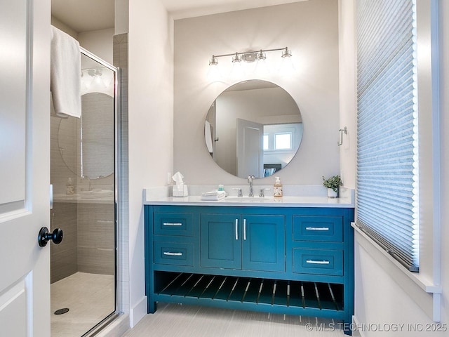 bathroom featuring vanity and a shower stall