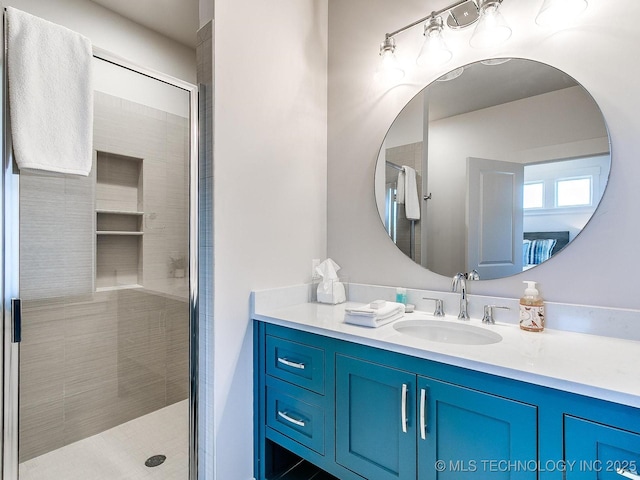 full bath with vanity and a stall shower