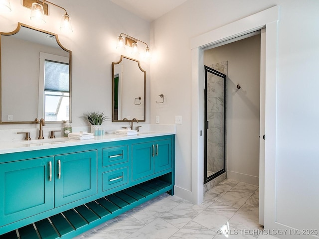 full bathroom with double vanity, a stall shower, marble finish floor, and a sink