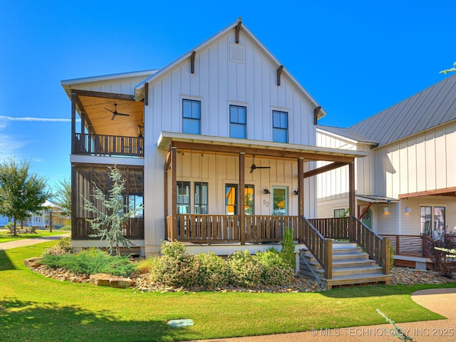 rear view of house featuring a porch, a ceiling fan, and board and batten siding