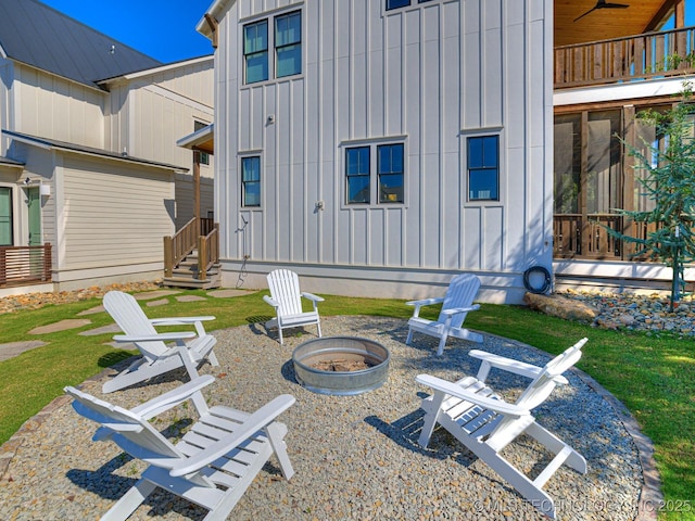 exterior space featuring entry steps, a patio, and a fire pit