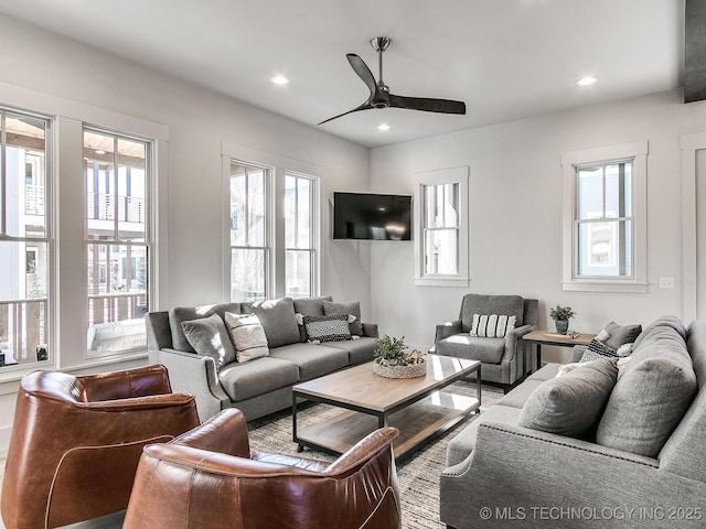 living area featuring a wealth of natural light, recessed lighting, and a ceiling fan