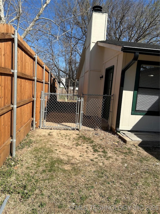 view of yard featuring a gate and fence