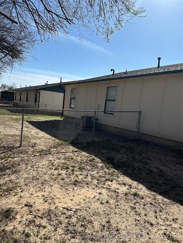 back of property featuring fence