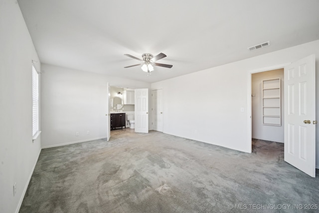 unfurnished living room with light colored carpet, visible vents, and ceiling fan