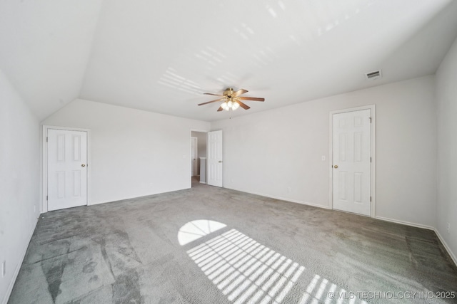 unfurnished bedroom with visible vents, carpet flooring, and a ceiling fan