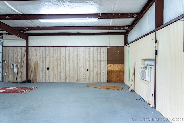 garage featuring wood walls