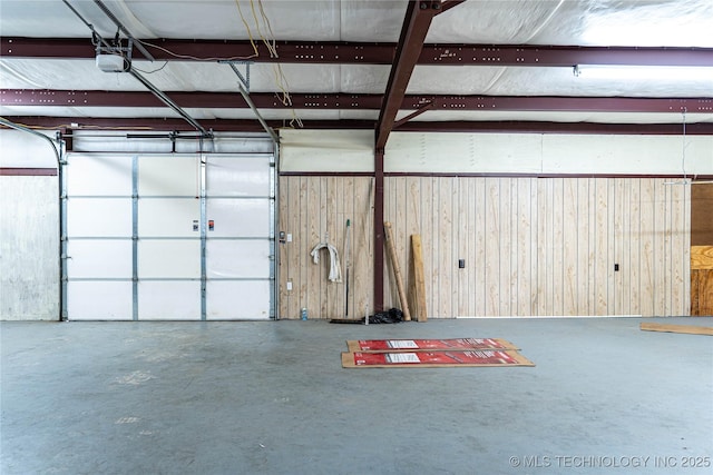 garage featuring wooden walls