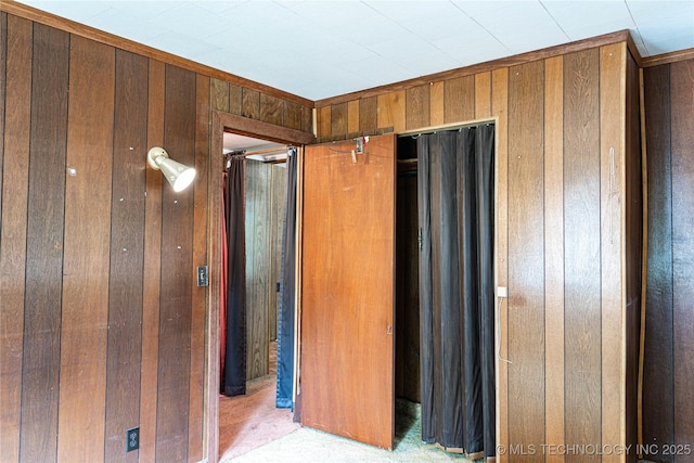 unfurnished bedroom with wood walls