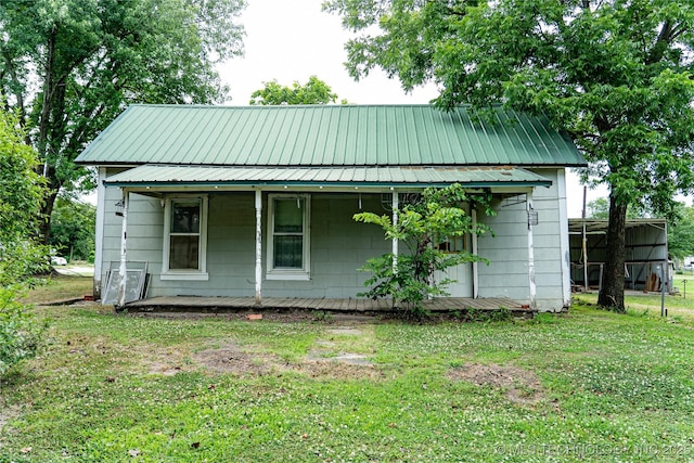 view of front of house with a front lawn and a porch