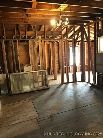 miscellaneous room featuring a notable chandelier