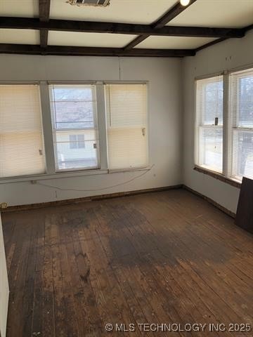 spare room with hardwood / wood-style flooring, baseboards, coffered ceiling, and beam ceiling