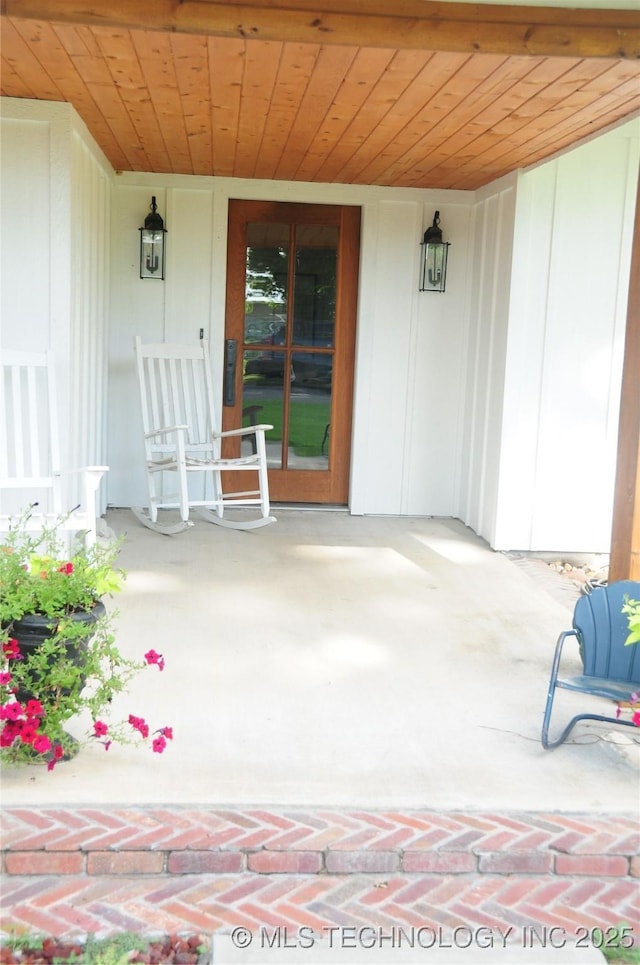 view of exterior entry with a porch