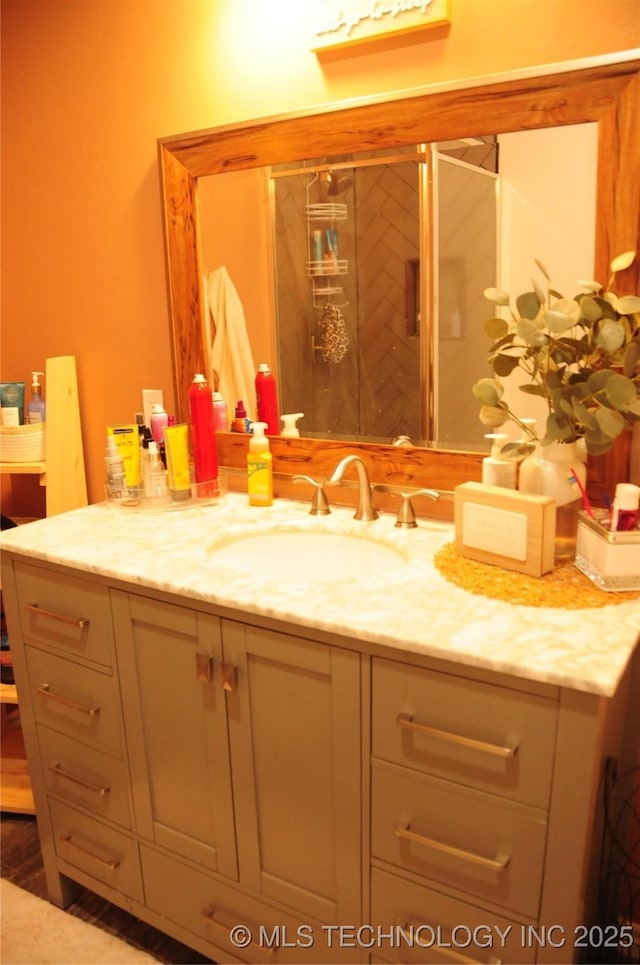 bathroom featuring vanity and a stall shower