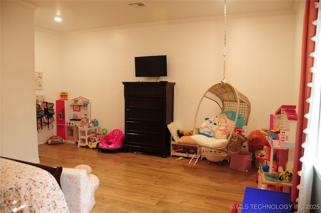 bedroom featuring crown molding, recessed lighting, visible vents, and wood finished floors