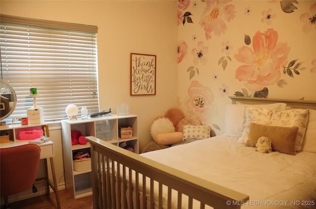 bedroom featuring wood finished floors