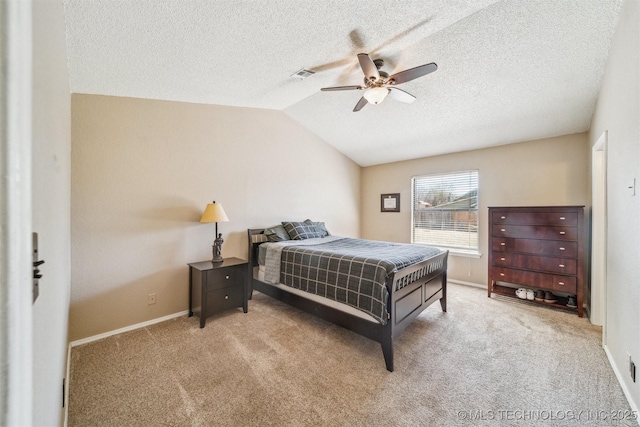 bedroom with carpet, baseboards, lofted ceiling, ceiling fan, and a textured ceiling