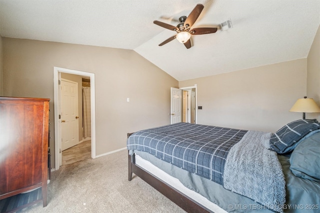 carpeted bedroom with visible vents, baseboards, ceiling fan, and vaulted ceiling