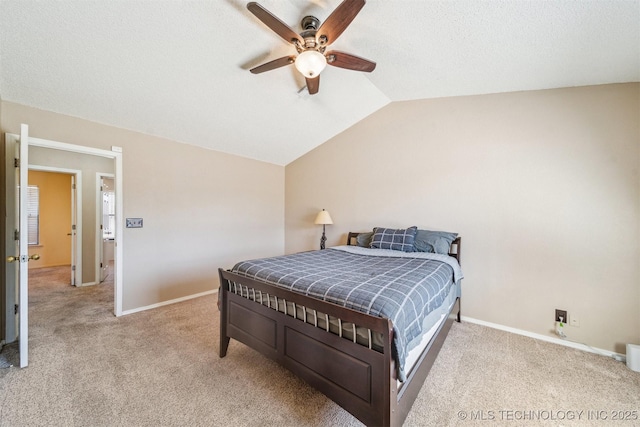 bedroom featuring baseboards, lofted ceiling, and carpet floors