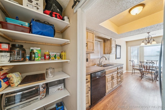 kitchen featuring a sink, open shelves, a textured ceiling, light wood-style floors, and dishwasher