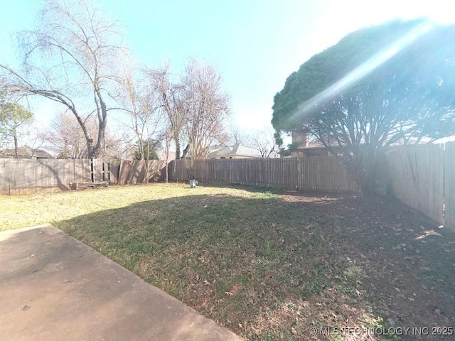 view of yard with a fenced backyard