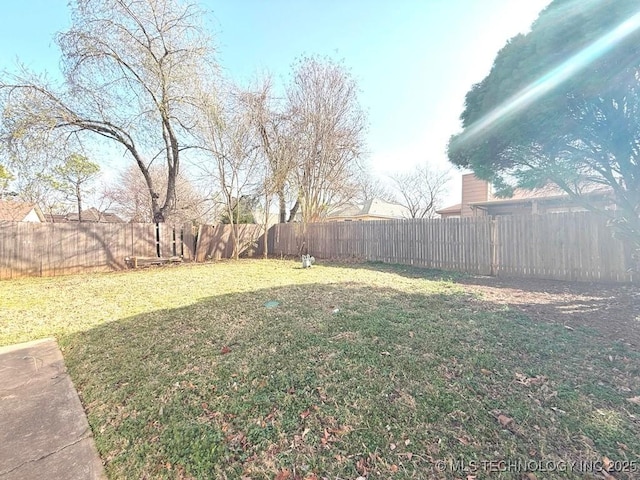 view of yard with a fenced backyard