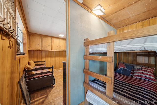 bedroom with wooden walls