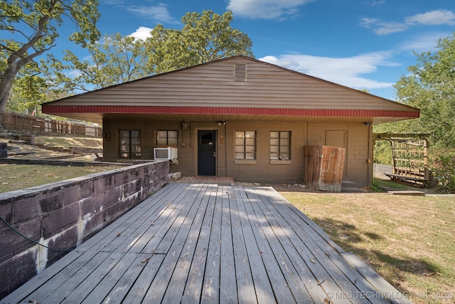wooden deck featuring a yard