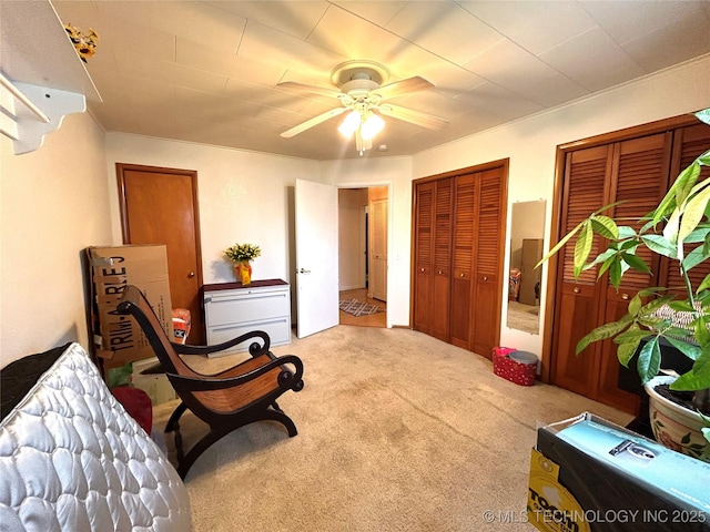 sitting room with carpet flooring and a ceiling fan