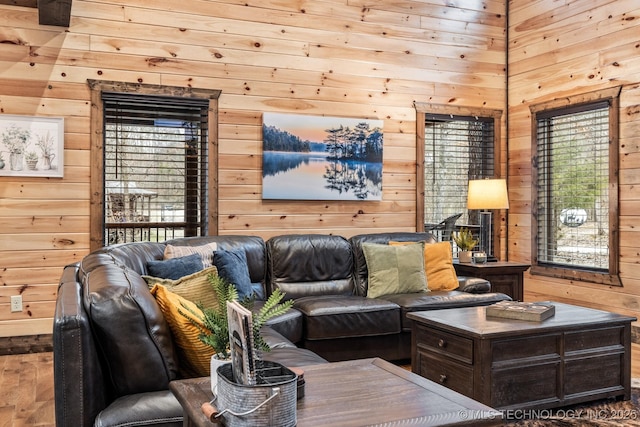 living room with wooden walls and wood finished floors