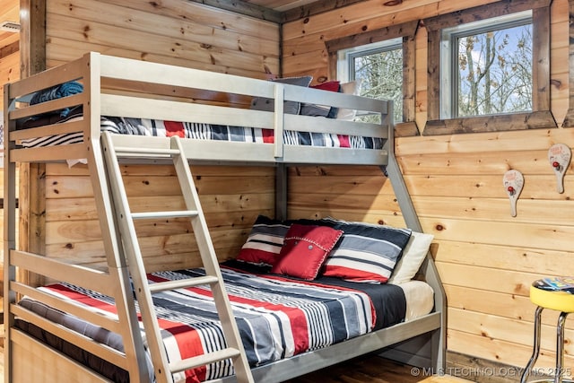 bedroom with wooden walls