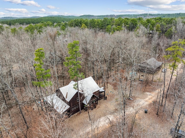 bird's eye view featuring a forest view