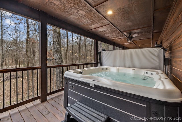 wooden terrace with a hot tub