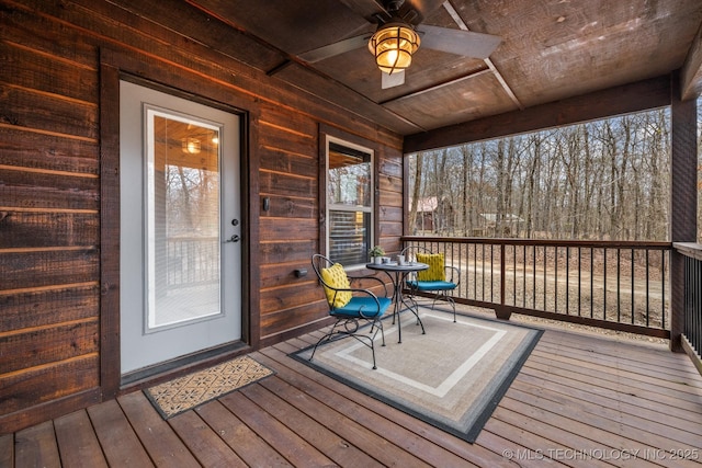 wooden terrace featuring ceiling fan