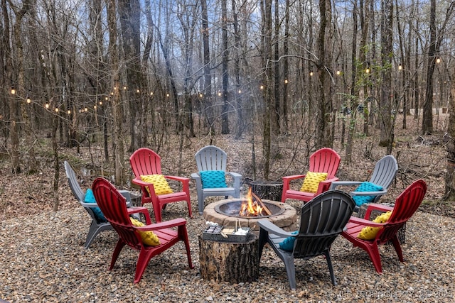 view of yard with a fire pit