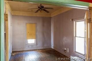 spare room featuring a ceiling fan and wood finished floors