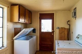 washroom with washing machine and dryer and cabinet space