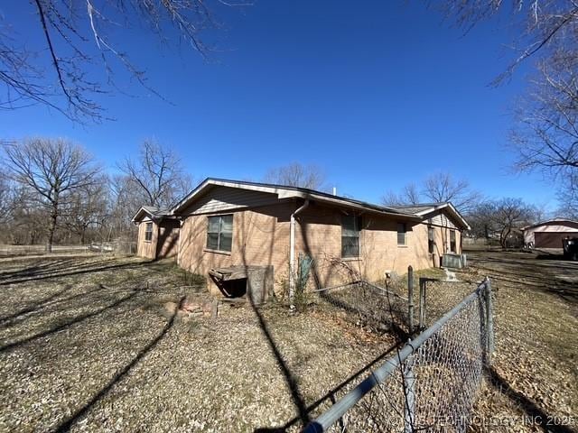 view of home's exterior featuring fence